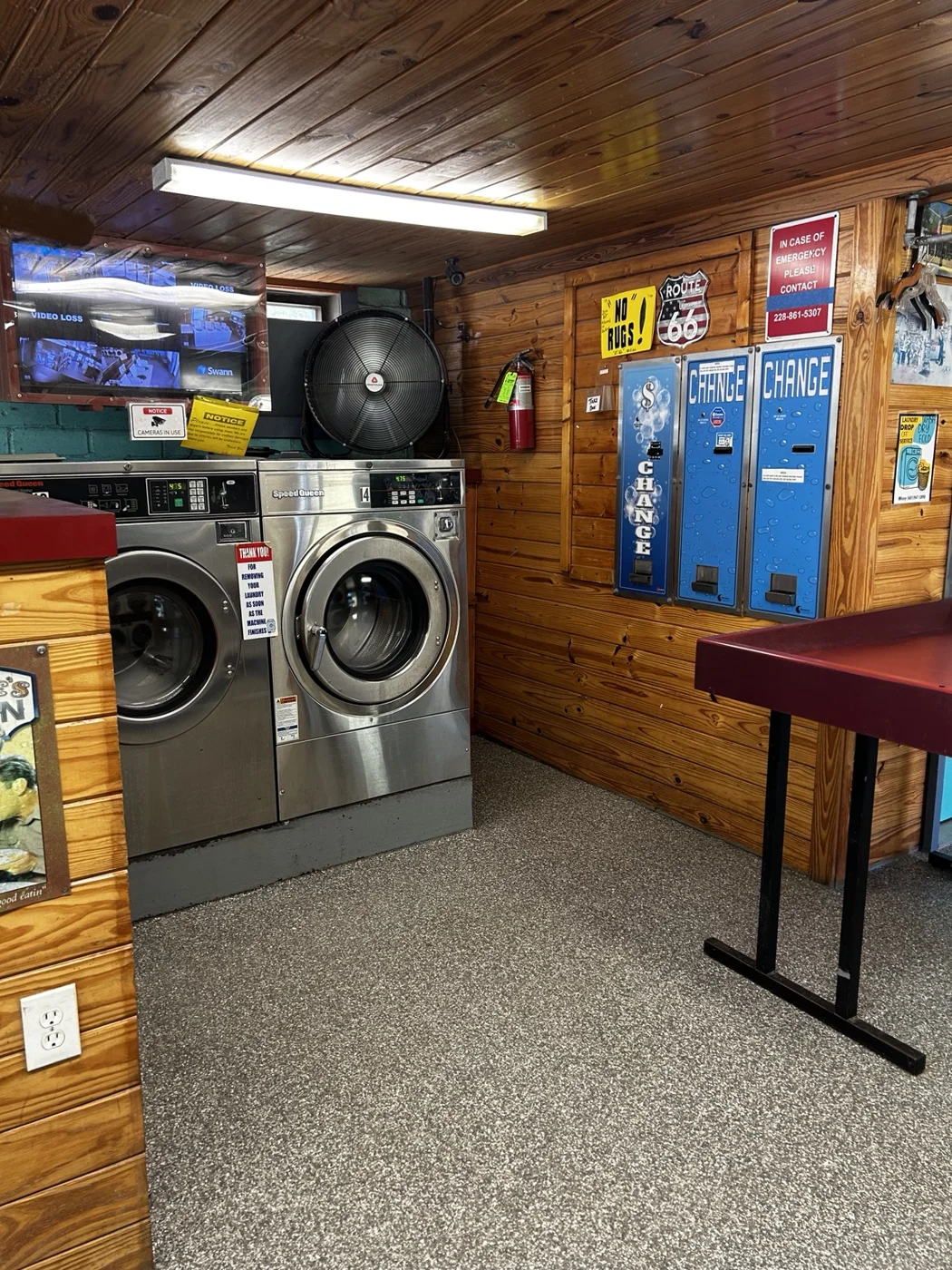 Front-loading washers beside blue change machines
