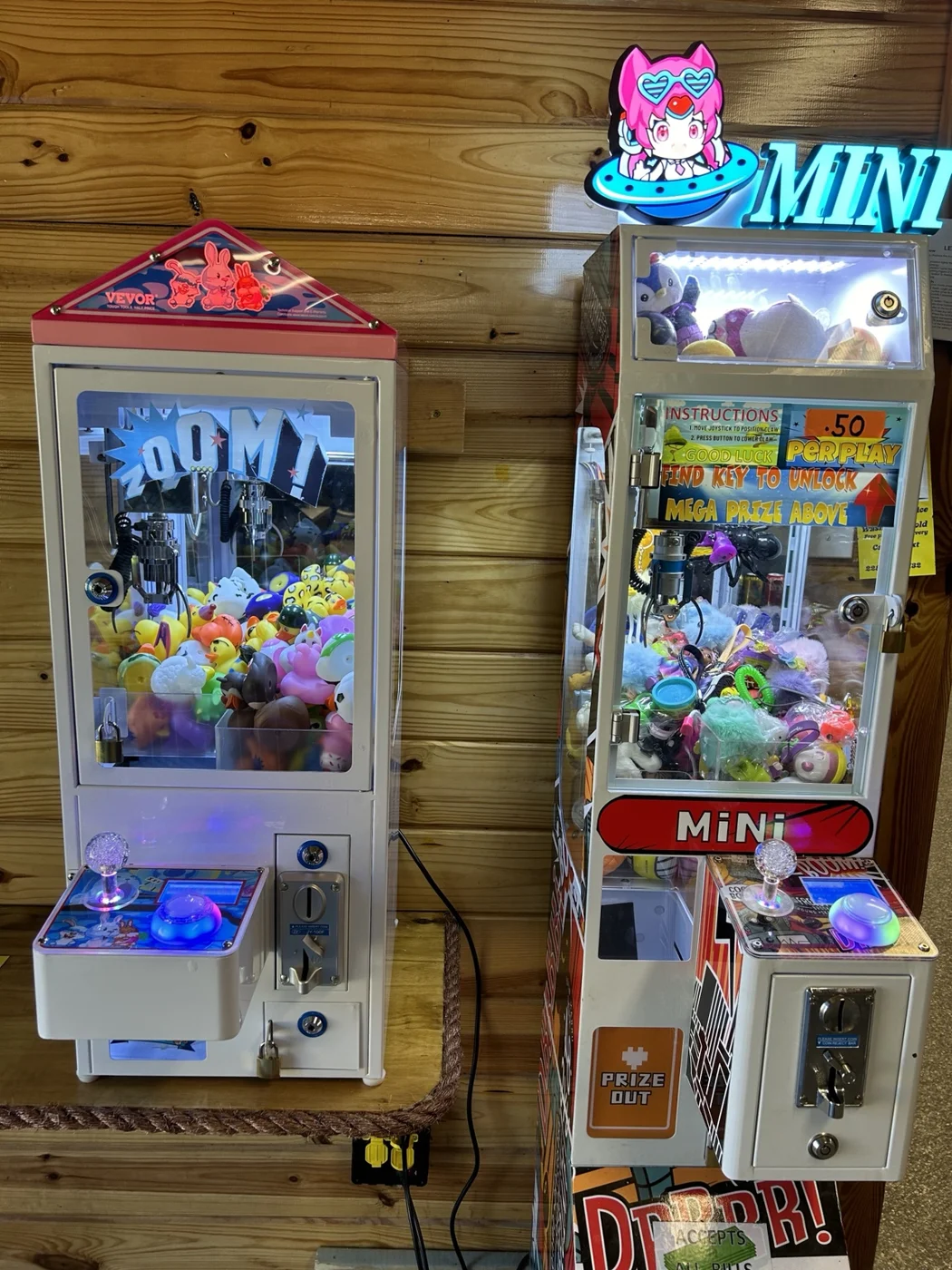 Two colorful claw machines at Goobers